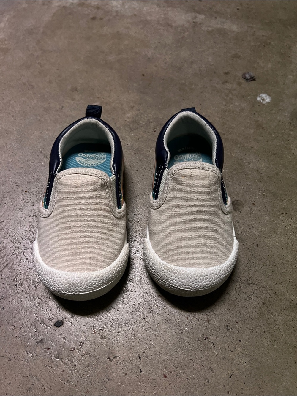 OshKosh B'gosh Slip-On Canvas Sneakers in Off-White and Navy Trim